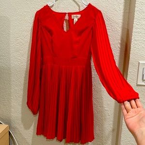 Red pleated dress